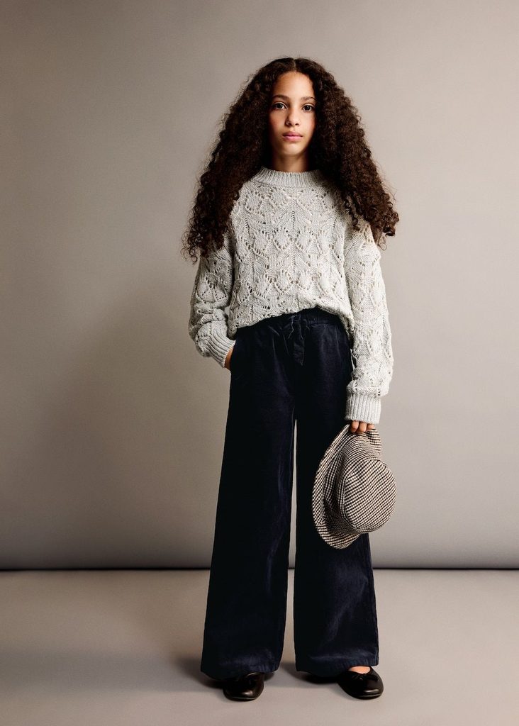 kid in corduroy pant with fitted sweater as stylish outfit ideas for active kids
