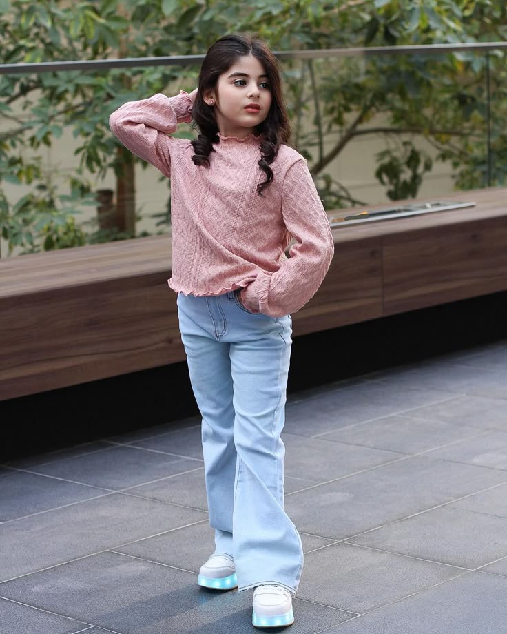 kid in stretch denim and fitted long sleeve as stylish outfit ideas for active kids