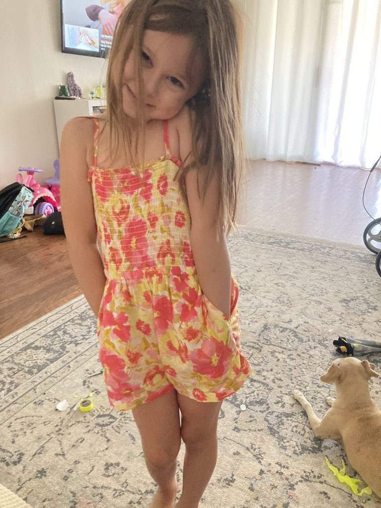kid in dress with a built-in short as stylish outfit ideas for active kids