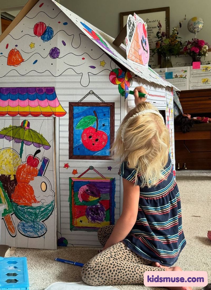 kid building a cardboard hunted house