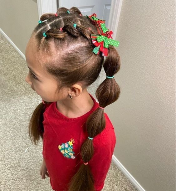 a kid with bubble ponytail as Christmas hairstyles for little girls