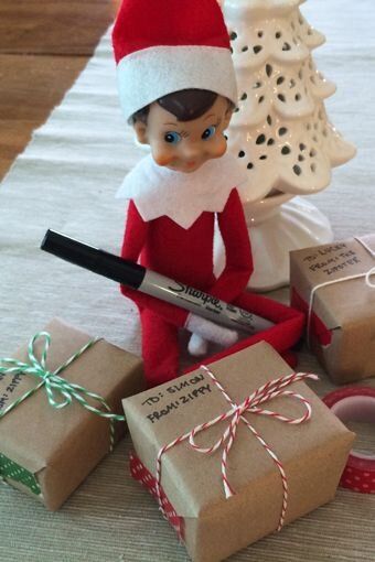 elf wraps a present