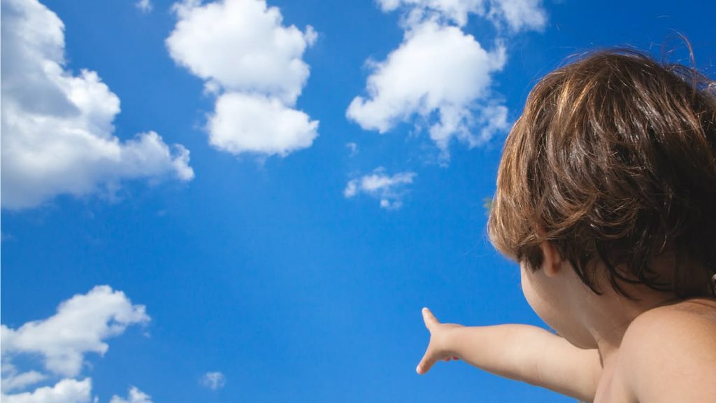 a kid that's cloud watching as backyard activities for kids