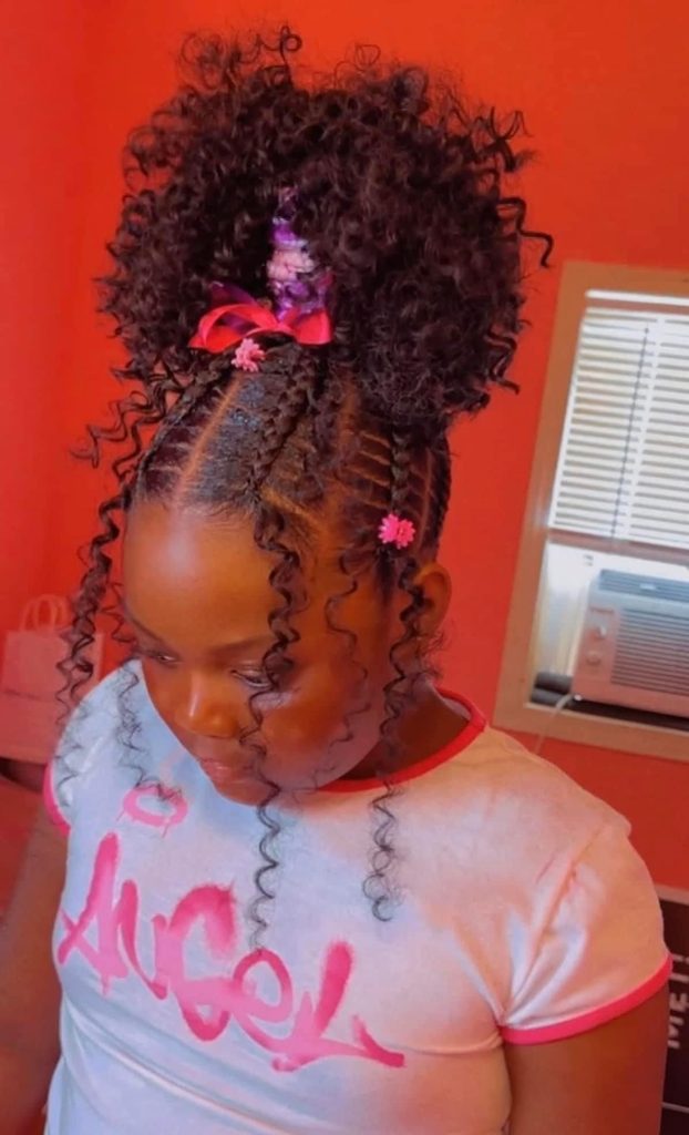 kid with loop braid ponytail as Christmas hairstyles for little girls