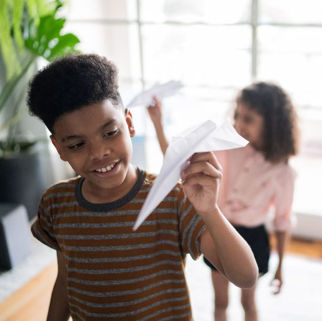 kids with paper airplanes