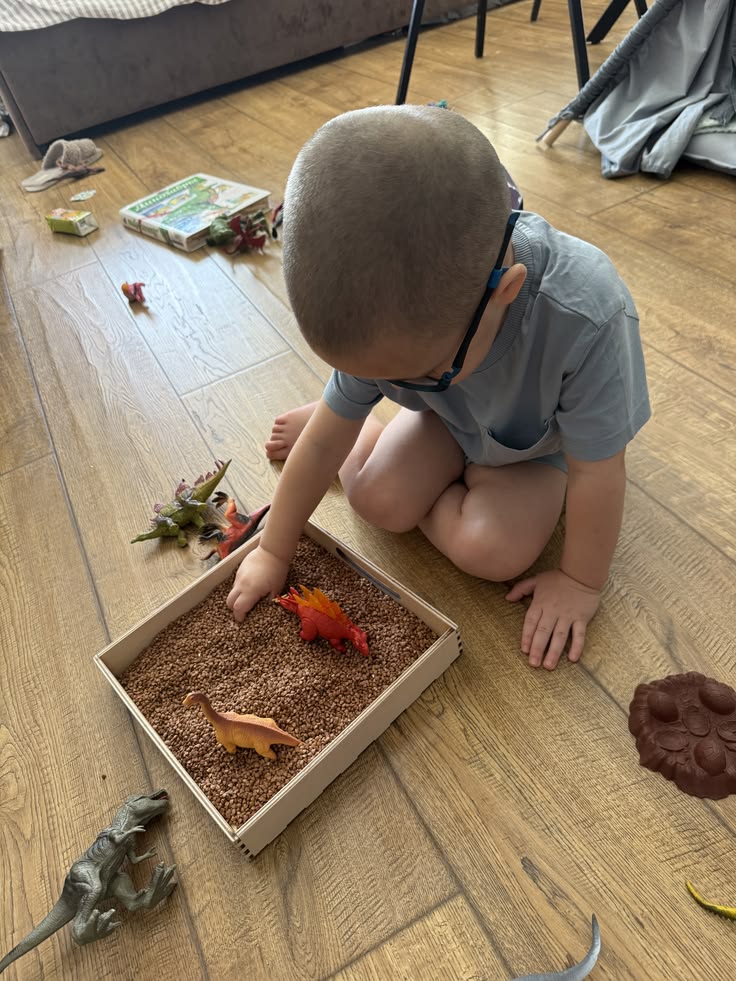 kid digging for dinosaur at home