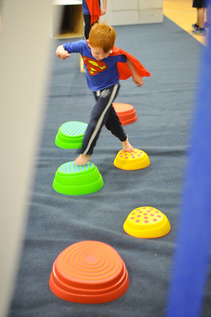 superhero girl complete obstacle course mission as superhero training course for kids